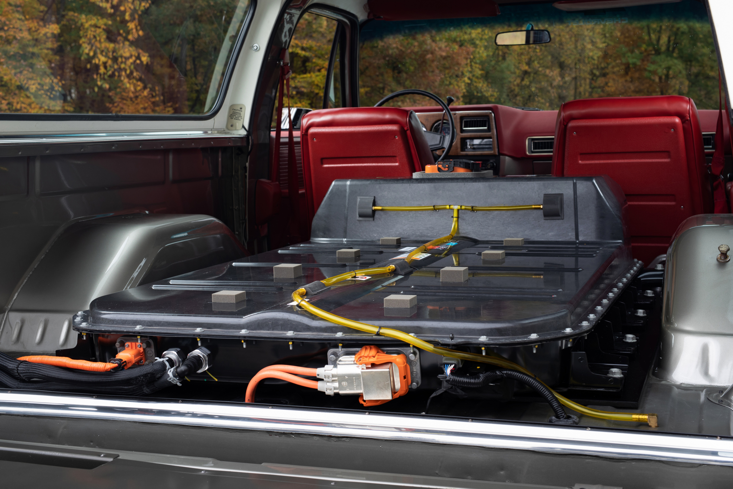 Power for the 1977 K5 Blazer-E is supplied by a 400-volt Bolt EV battery pack with 60 kilowatt-hours of usable energy installed in the cargo area. Using production controllers and wiring harnesses preserves many Bolt EV features, including shock protection, battery heating and cooling, battery-overcharge protection and even regenerative braking.